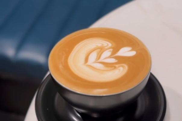 Latte with a leaf/heart design in foam