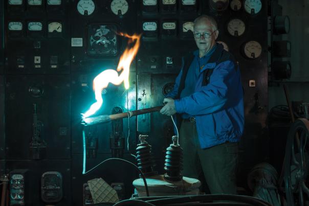 Tommy Bolack sparks a transformer in his electromechanical museum.