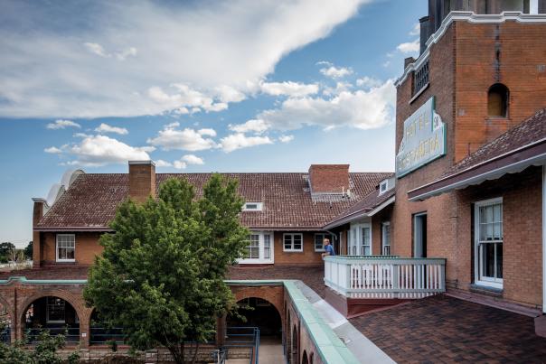 Allan Affeldt stands on the newly built balcony of the Castañeda's library.