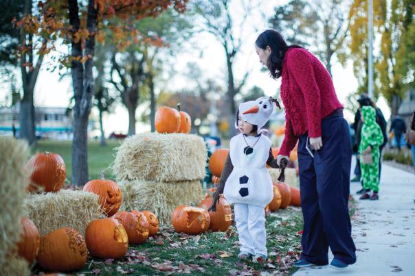 Little girl, dressed as Olaf from Frozen, and her grandmother at Los Alamos Halloween