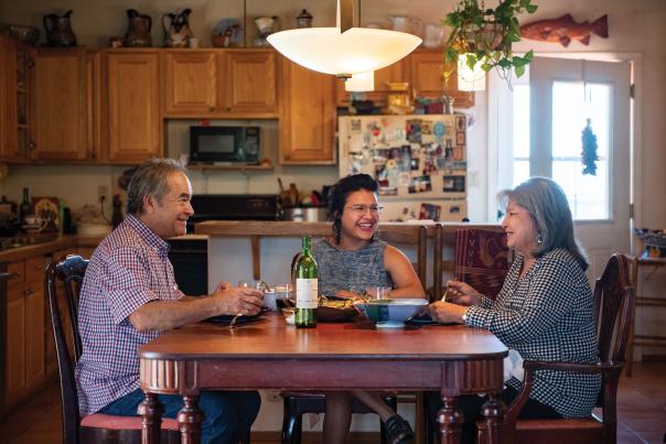 Richard, Alicia, and Dolores Guzmán dig in.