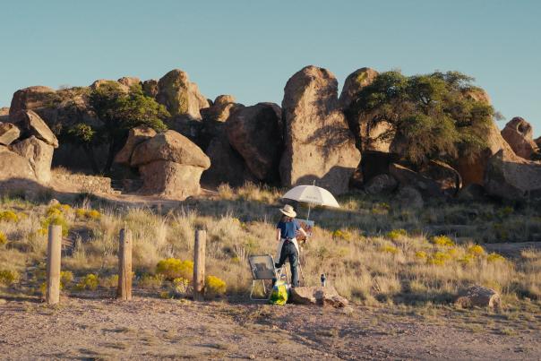 A woman doing plein air painting at City of Rocks State Park, New Mexico