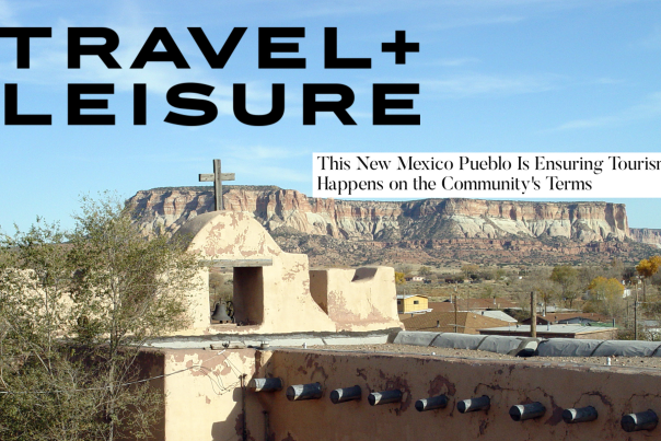 a traditional chapel sits before a large plateau in the distance. Text reads Travel + Leisure. This New Mexico Pueblo is Ensuring Tourism Happens on the Community's Terms