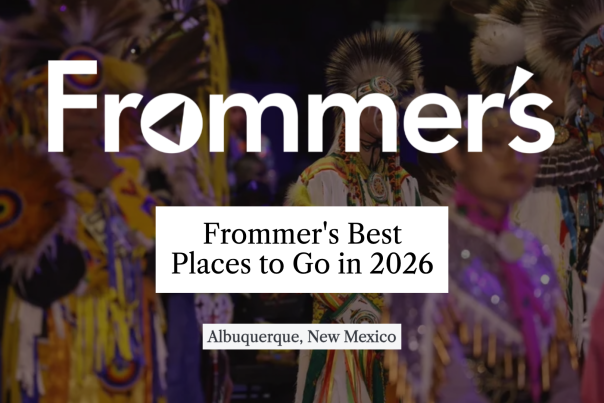 Background image of Native Americans in traditional dress taken at Gathering of Nations with text overlaid that reads, "Frommer's: Best Places to Go in 2026 - Albuquerque, New Mexico."