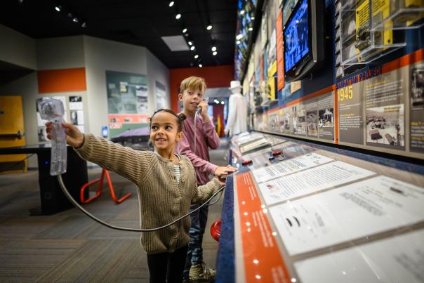 Children playing with an interactive science exhibit at the Bradbury Museum in Los Alamos, New Mexico