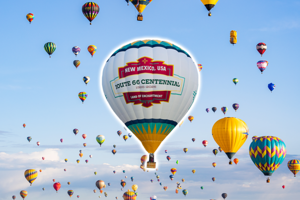 picture of hot air balloon with the Route 66 Centennial logo among sky of other hot air balloons