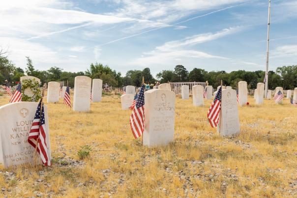American flags mark the graves of veterans, whose collective service begins with the Civil War and runs through the Korean War at Fairview Memorial Park
