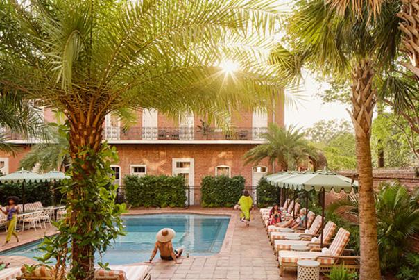 People relax by the pool at the Hotel St. Vincent, a boutqiue hotel in the Lower Garden District of New Orleans