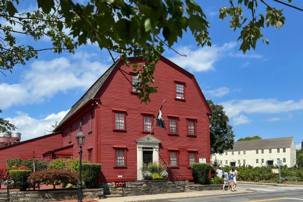 Exterior photo of the red White Horse Tavern from across the street.