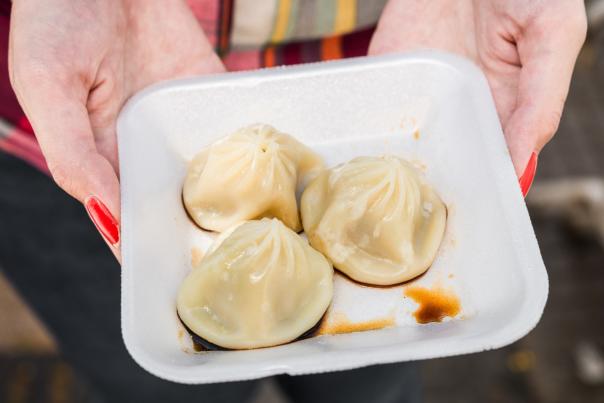 traditional Chinese pork dumplings at street food market.