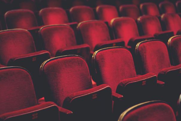 rows of red chairs in the theater
