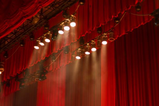 Red curtain with spotlights in the theater
