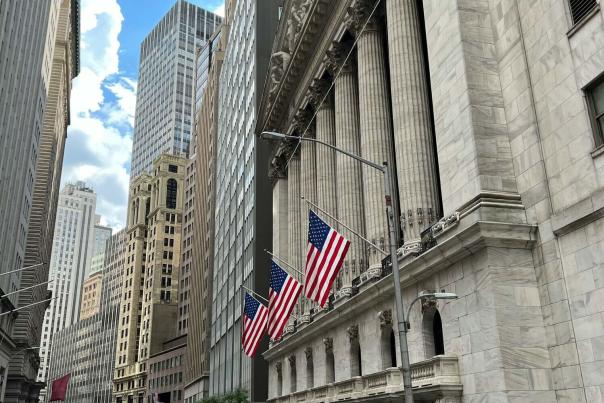 Lower Manhattan Financial District skyline with One World Trade Center visible above the Hudson River waterfront