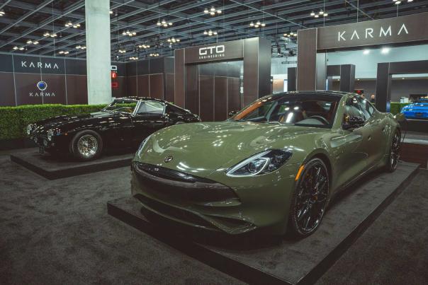 Sleek luxury sports car presented under spotlight at auto show exhibition