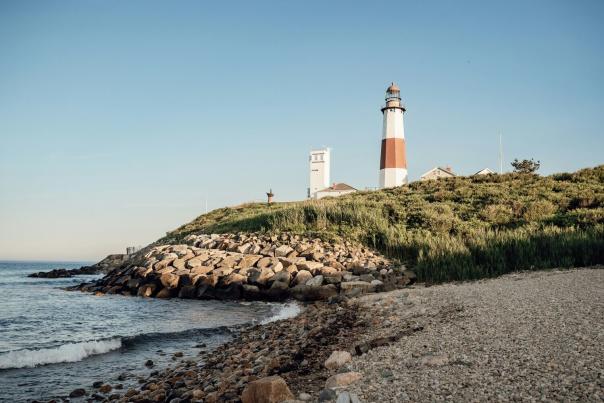Montauk Point Lighthouse perched above the ocean on the eastern tip of Long Island, New York, on a clear day