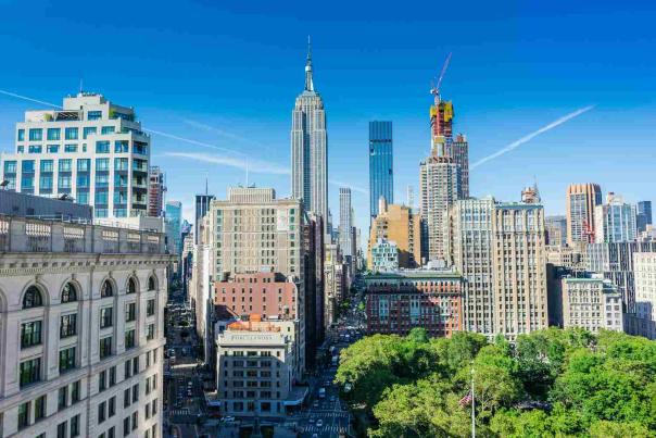 High-angle view looking at a variety of New York City skyscrapers, capturing the kind of architectural detail.
