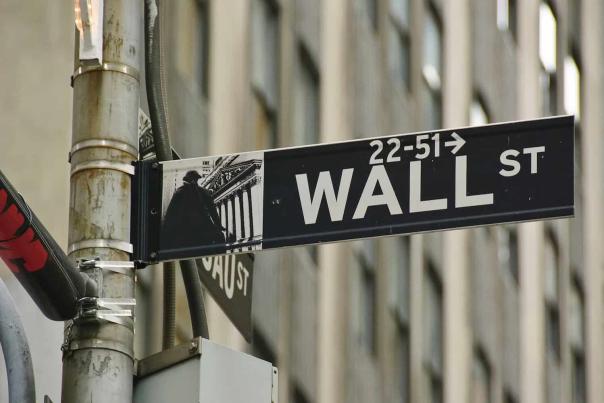 Wall Street street sign in Lower Manhattan, tied to the history of American finance and the Financial District
