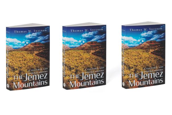 Cover of "The Jemez Mountains: A Cultural and Natural History" by Thomas W. Swetnam, featuring a mountain scene with golden grasses.
