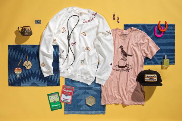 Collection of souvenirs and goods from Black Diamond Curio in Santa Fe, including T-shirts, jewelry, hats, ornaments, and ceramic.