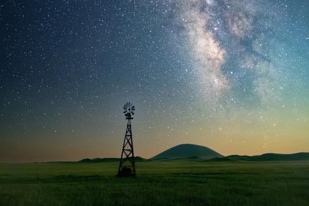 Anthony Crowley's shot of a windmill under the Milky Way sky and Capulin Volcano in the distance.