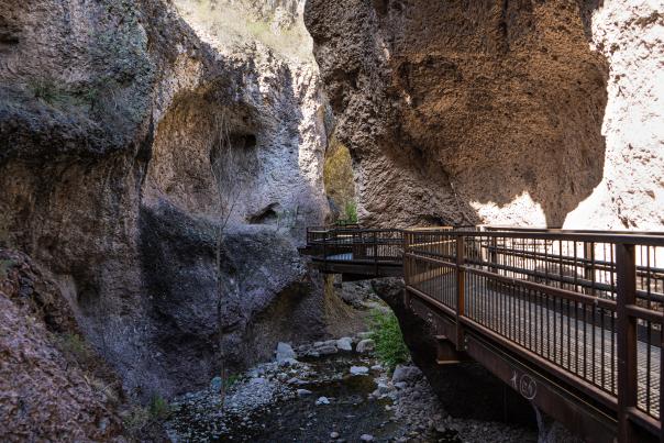 The Catwalk National Recreation Trail leads hikers through towering canyon walls.