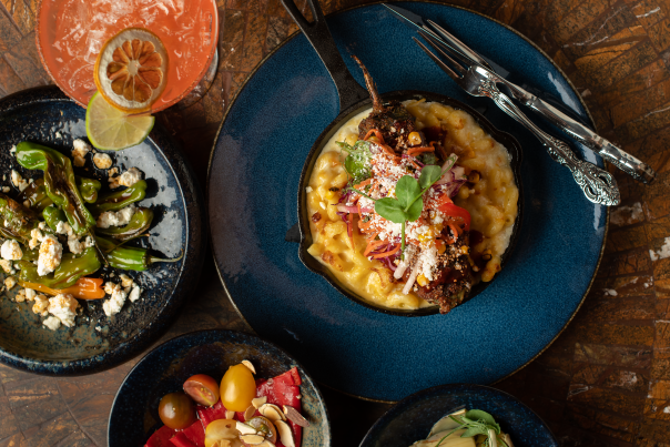 At De La Tierra, in Taos, chef Cristina Martinez’s rellenos are stuffed with pulled pork and served on a bed of mac and cheese
