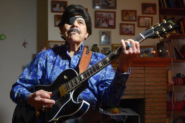 Al Hurricane tunes his guitar in 2016, a defining figure in New Mexico music.
