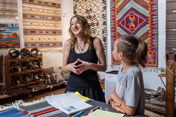 Emily Trujillo helps a student at Centinela Traditional Arts.
