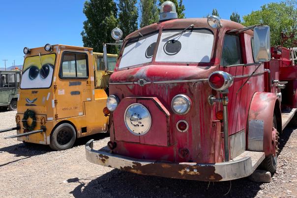 Lance Giest's collection of vintage vehicles with painted eyes in Tularosa, inspired by the movie "Cars," showcases unique personalities of each vehicle.