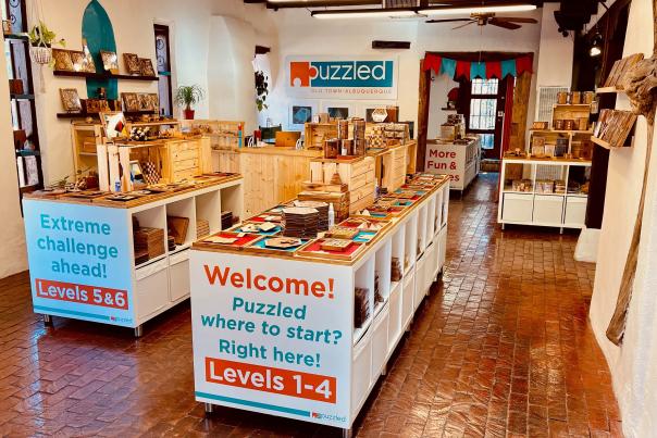 Puzzled encourages shoppers to hang out and play a game of pegboard checkers or attempt to escape the Crazy Loops Handcuffs.