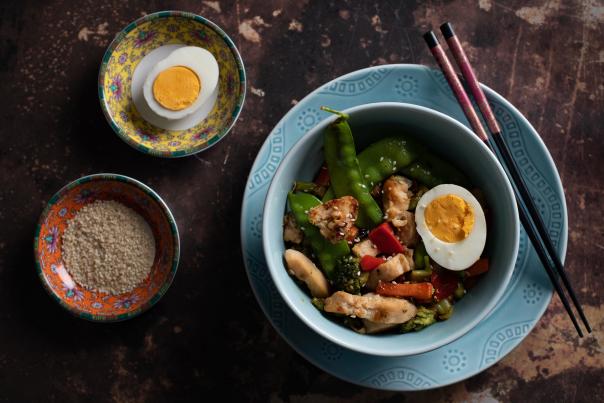 Add seasonal veggies and an optional egg to this velveted chicken stir-fry.