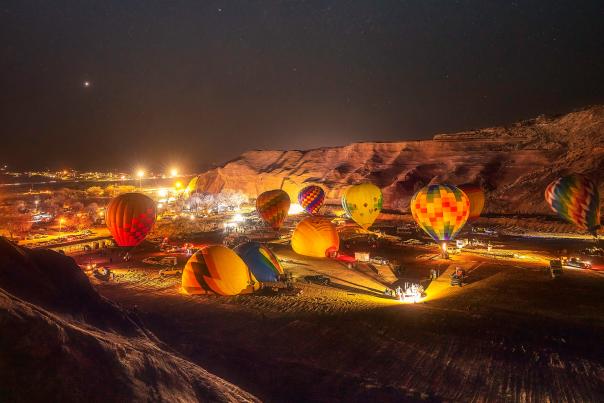 A balloon glow lights up Red Rock Park.