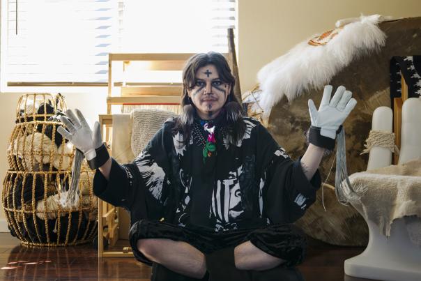 Eric‑Paul Riege in his Gallup studio surrounded by materials and works in progress, reflecting his self‑description as “a decorator at heart.”