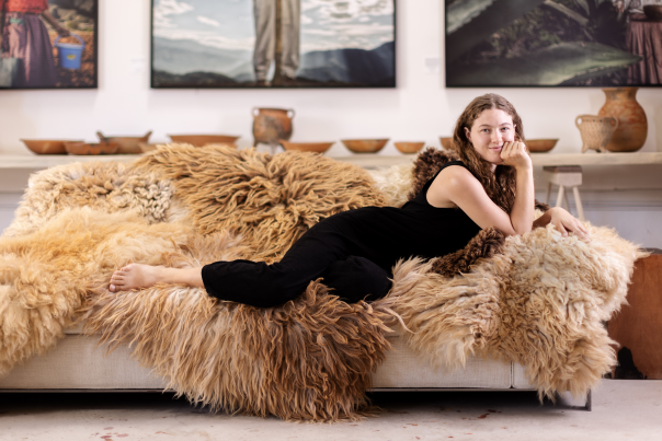 Treska Stein relaxes on a selection of Sheepä hides in (from right) Honey ($600), Shoyu ($575), Honeycomb ($725),  and Milk ($625) at Living Threads Studio, in Santa Fe.