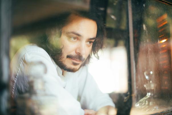 Max Gomez staring out a window.