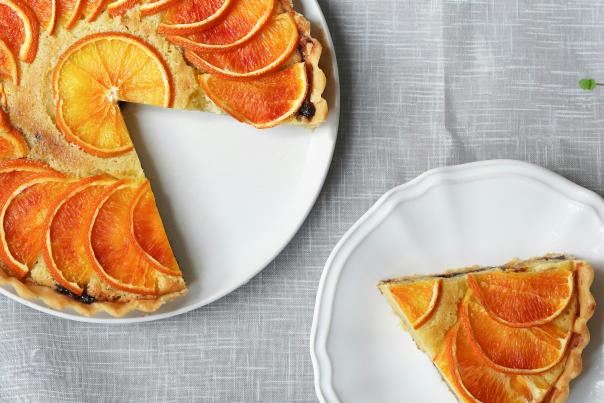 Clementine cake on a white platter.