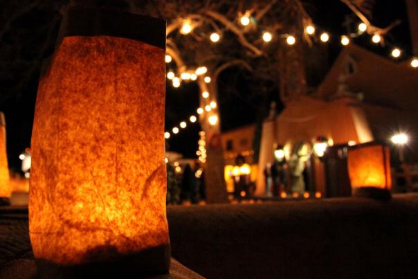 On Christmas Eve, thousands of farolitos light up the paths to San Felipe de Neri Church in Albuquerque’s Old Town.