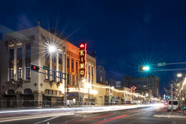 Nighttime photos of the neon-lit KiMo Theatre.