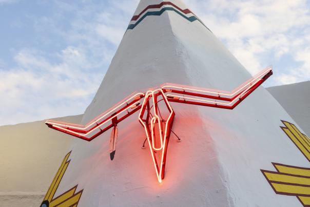Glowing neon longhorn sign at Teepee Curios in Tucumcari.