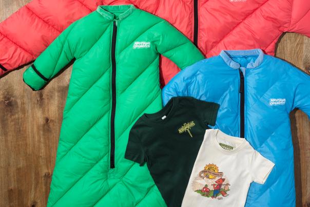 Morrison Outdoors sleeping bags for adults and children laid out on a wood floor.