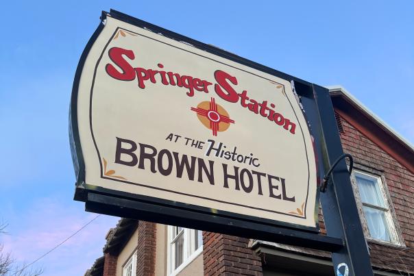 Exterior of Springer Station, a restored historic hotel with vintage Western character and updated accommodations.