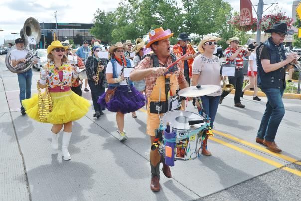 Marchers in the Los Alamos County Fair Rodeo Parade make their way down Central Avenue.