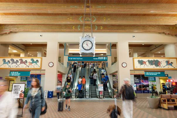 Pop Chalee paintings flank the escalators, centered by a 
four-sided punched-tin clock.