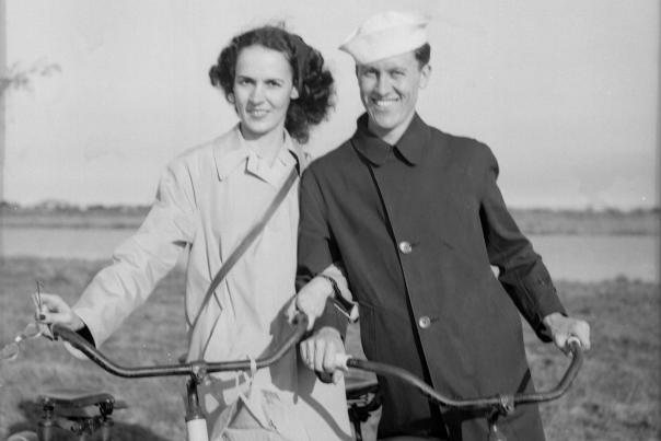A formal portrait of Mary Taylor and J. Paul Taylor on their wedding day, posing together as newlyweds.