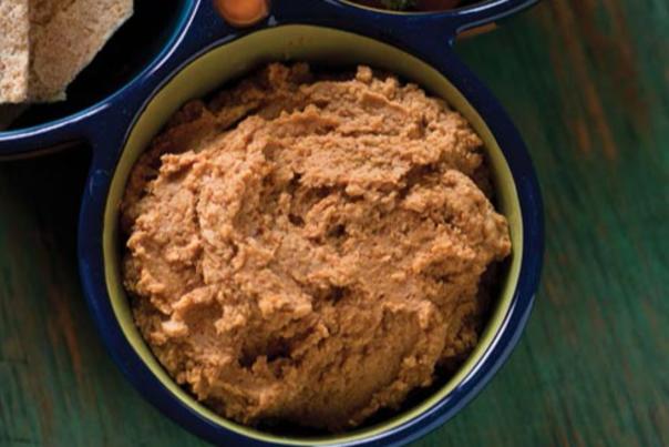 A bowl of red chile hummus