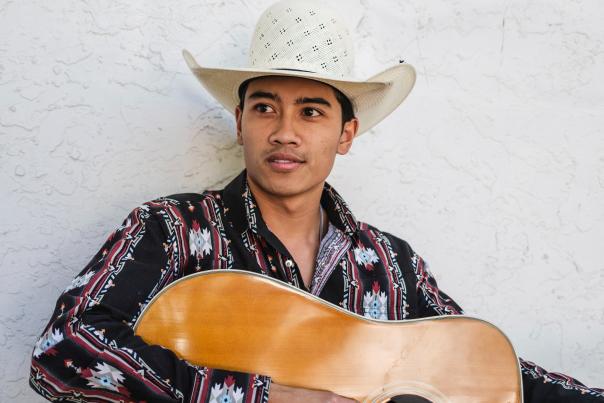 Country artist Dzaki Sukarno plays guitar as part of the New Mexico State Fair concert lineup.
