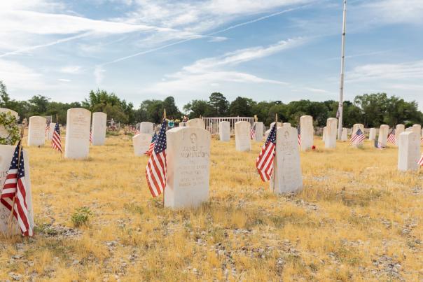 American flags mark the graves of veterans, whose collective service begins with the Civil War and runs through the Korean War at Fairview Memorial Park