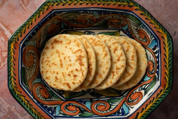 A colorful plate of six Mesa Provisions duck fat flour tortillas.