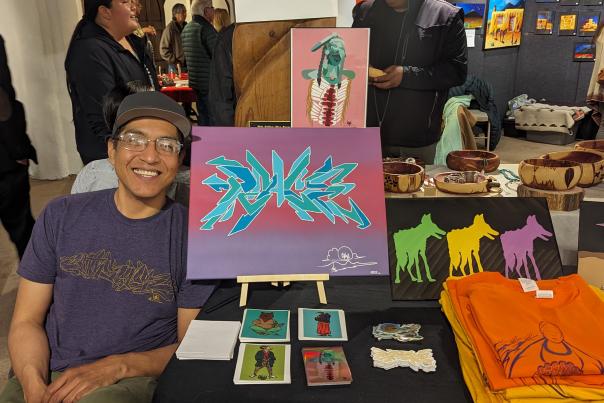 Artist Abran Shorty (Taos Pueblo) at the Taos Pueblo Artists’ Winter Showcase held a the Millicent Rogers Museum.