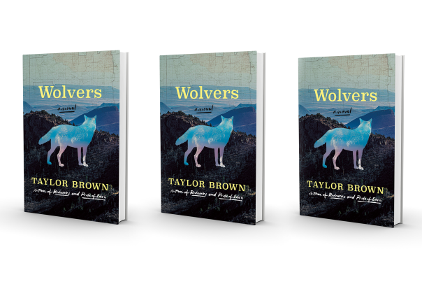 Three copies of the book "Wolves" by Taylor Brown are displayed, featuring a stylized, blue-toned wolf against a backdrop of mountainous terrain.
